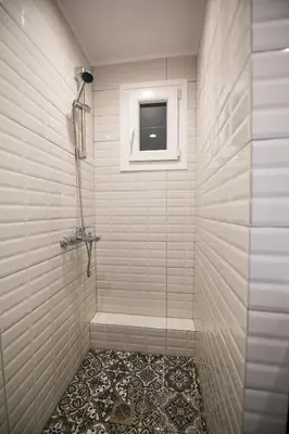 a bathroom with a shower with a window at White Lux Apartment For 2 VIPGreece in Athens