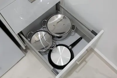 two pans in a drawer in a kitchen at White Lux Apartment For 2 VIPGreece in Athens