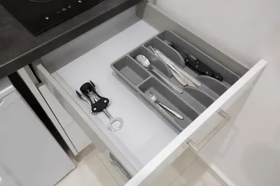 a drawer in a kitchen with some knives and scissors at White Lux Apartment For 2 VIPGreece in Athens