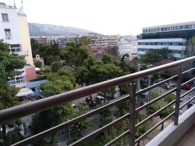 a view of the city from a balcony at Paidon Studio in Athens