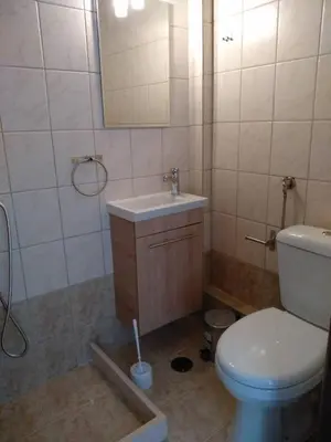 a bathroom with a toilet and a sink at Paidon Studio in Athens