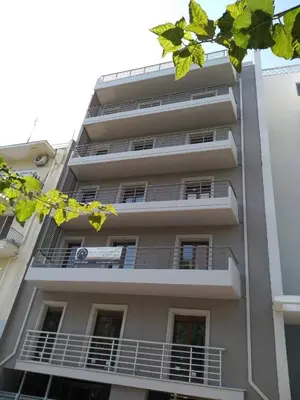 an apartment building with balconies on the side of it at Paidon Studio in Athens