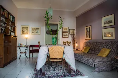 a living room with a table and a couch at Sophie's Penthouse in Athens in Athens