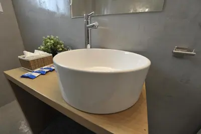a large white sink on a counter in a bathroom at Cosy appartment in the heart of Athens in Athens