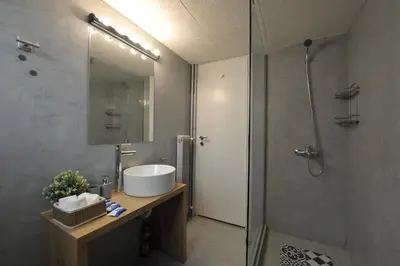 a bathroom with a sink and a shower at Cosy appartment in the heart of Athens in Athens