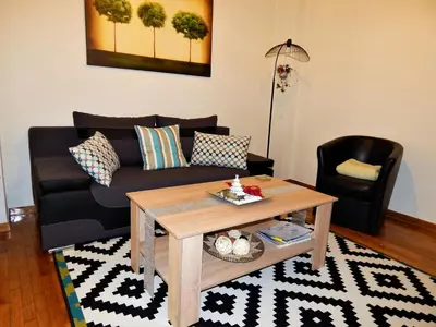 a living room with a couch and a coffee table at ANNA in Athens