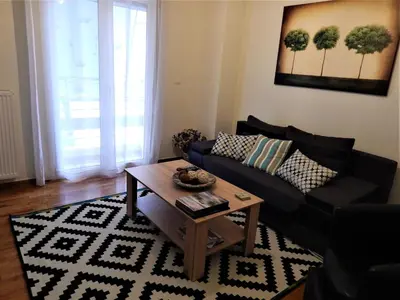 a living room with a couch and a coffee table at ANNA in Athens