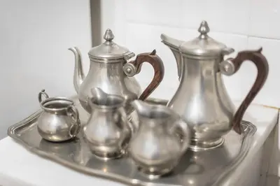 a tray with three tea pots and pitchers on it at Athens Centre Flat 2 min. from Evangelismos Metro in Athens