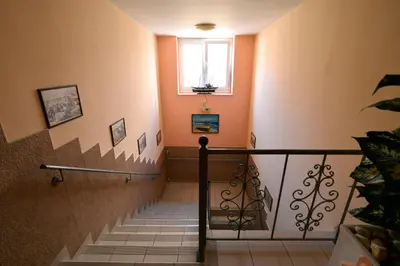 a stairway with a window and a stair case at Electra Hotel Piraeus in Piraeus