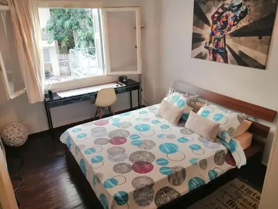 a small bedroom with a bed and a window at Alexandras Metro Studio&200mbps in Athens