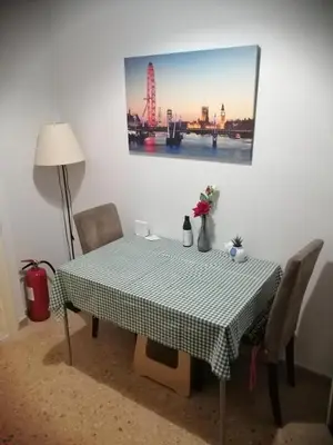 a dining room table with a checkered table cloth on it at Alexandras Metro Studio&200mbps in Athens