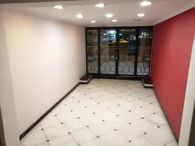 an empty room with a white floor and red walls at Alexandras Metro Studio&200mbps in Athens