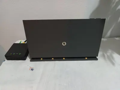 a black laptop computer sitting on top of a bed at Alexandras Metro Studio&200mbps in Athens