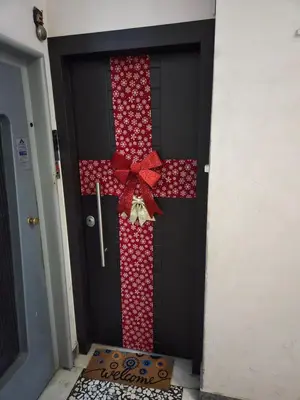 a black door with a red bow on it at Alexandras Metro Studio&200mbps in Athens