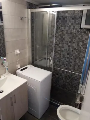 a bathroom with a shower and a toilet and a sink at MyHome! Modern, huge, central, quiet, clean in Athens