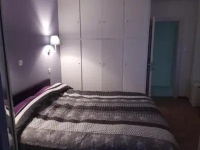 a bed in a room with at MyHome! Modern, huge, central, quiet, clean in Athens
