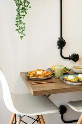 a table with two plates of food on it at Môss Suite - Monastiraki Square View in Athens