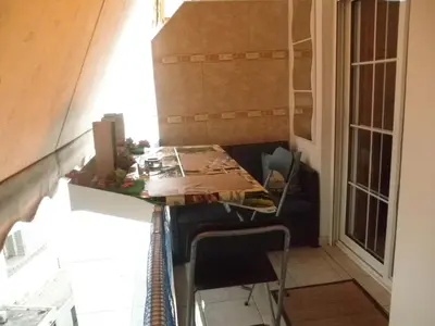 a small room with a table and chairs and a window at Dreaming Stay in Athens
