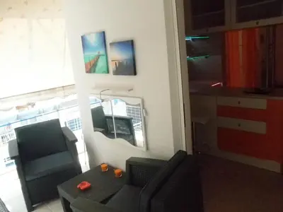 a living room with a couch and a chair at Dreaming Stay in Athens