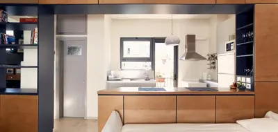 a kitchen with a wooden counter and a sink at Two level apartment with panoramic view in Athens