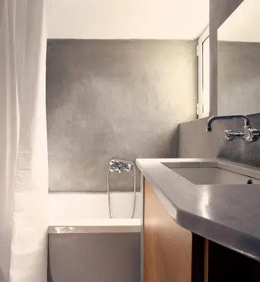 a bathroom with a sink and a bath tub at Two level apartment with panoramic view in Athens