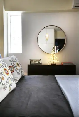 a bedroom with a large mirror and a bed at Mets Area, Hip, Tasteful & Ultra Convenient Studio for 2 in Athens