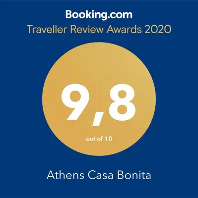 a yellow circle with the text travel review awards athens case bonita at Athens Casa Bonita in Athens