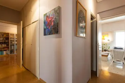 a hallway of a home with a painting on the wall at 2 Bedroom Artist's Apartment - So Athens in Athens