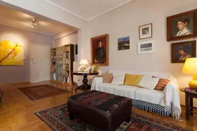 a living room with a couch and a table at 2 Bedroom Artist's Apartment - So Athens in Athens