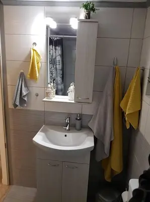 a bathroom with a sink and a mirror at Golden Aurora - Modern Apartment in Egaleo-Athens in Athens