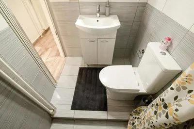 a small bathroom with a sink and a toilet at Golden Aurora - Modern Apartment in Egaleo-Athens in Athens
