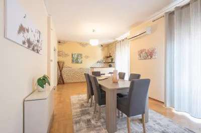 a dining room with a table and chairs at Acropolis View in Athens