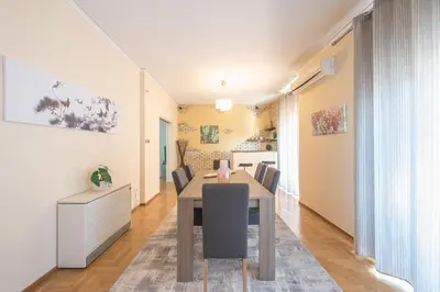 a dining room with a table and chairs at Acropolis View in Athens