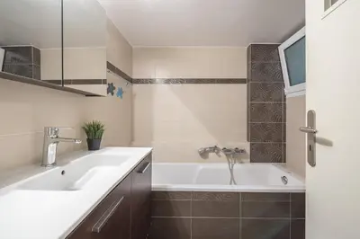 a bathroom with a sink and a bath tub at Acropolis View in Athens