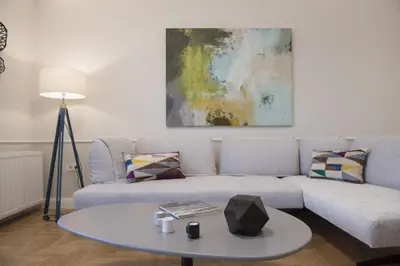 a living room with a couch and a table at Chic central Athens apartment at Mavilli Sq. in Athens