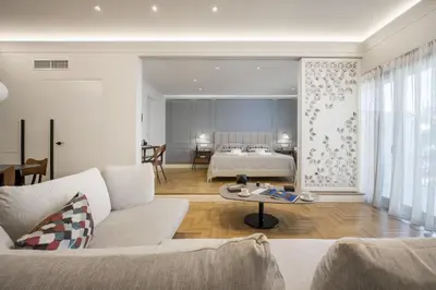 a living room with a couch and a bed at Chic central Athens apartment at Mavilli Sq. in Athens