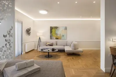 a living room with a couch and a table at Chic central Athens apartment at Mavilli Sq. in Athens