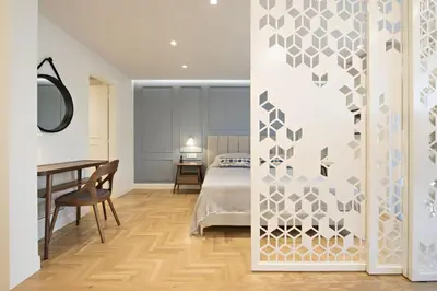 a bedroom with a bed and a table and a desk at Chic central Athens apartment at Mavilli Sq. in Athens