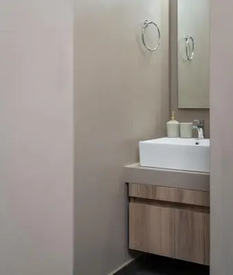 a bathroom with a sink and a mirror at Absolute Athens v in Athens