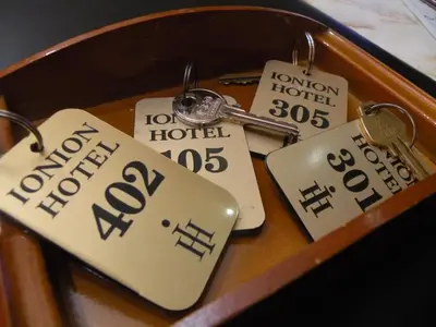 a bunch of keys on a table with price tags at Hotel Ionion in Piraeus