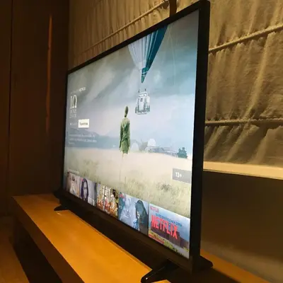 a flat screen tv sitting on top of a table at Evelina’s apartment in Athens