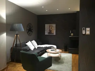 a living room with a couch and a table at Evelina’s apartment in Athens