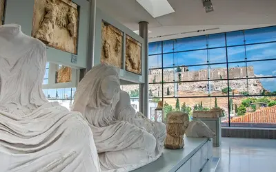 a large statue in a museum with a view ofhens at Bring only your toothbrush! in Athens