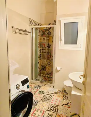 a bathroom with a shower and a toilet at Bring only your toothbrush! in Athens