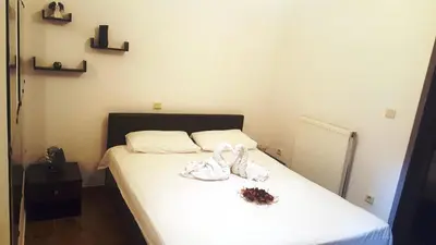 a bedroom with a bed with two white towels on it at Horizon apartment Athens near to Acropolis, sea & subway in Athens
