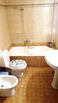 a bathroom with a toilet and a sink and a tub at Horizon apartment Athens near to Acropolis, sea & subway in Athens