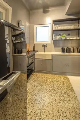 a kitchen with a sink and a counter at Superb 1BD Apartment in the heart of Kolonaki by UPSTREET in Athens