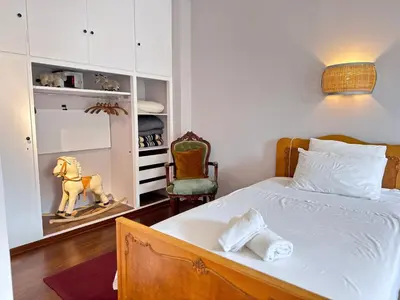 a bedroom with a bed with a horse on it at Friends & Family in Athens