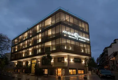 an office building with a sign on the side of it at Athens Platinum Rooms and Suites in Athens