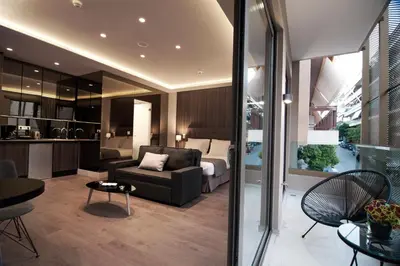 a living room with a bed and a couch at Athens Platinum Rooms and Suites in Athens